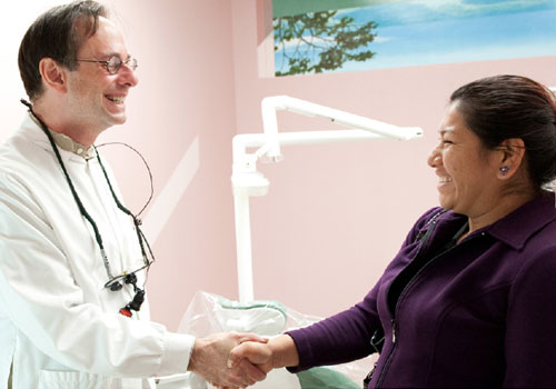 Woman and doctor shaking hands
